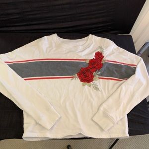 white cropped long-sleeve with embroidered flowers